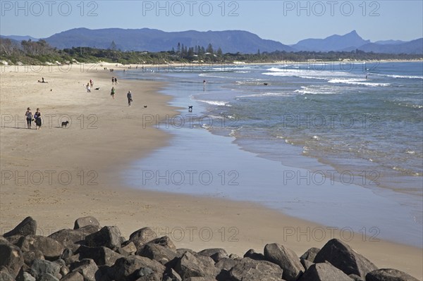 Tourists strolling on the beach at Byron Bay along the Coral Sea, New South Wales, Australia, Oceania