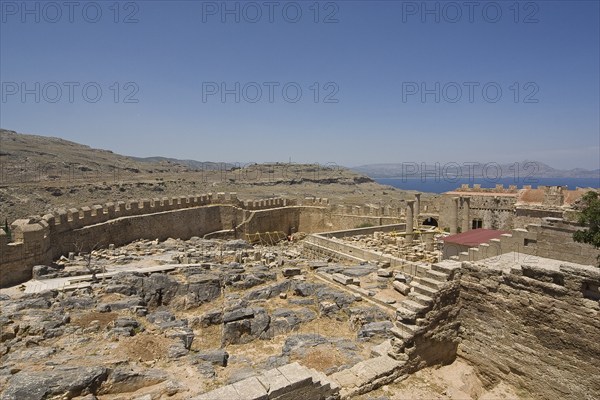 Rhodes Island, Lindos, Lindos is a town on the Greek island of Rhodes. Its landmark is the acropolis on a rock with huge archways from the 4th century and reliefs dating from around 280 BC. Ruins