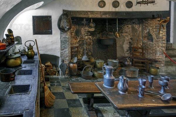 Kasteel van Laarne, interior showing kitchen and open fireplace inside 14th century medieval moated castle near Ghent, East Flanders, Belgium, Europe