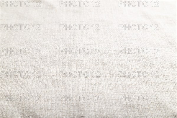 Fragment of smooth white linen tissue. Side view, natural textile background and texture