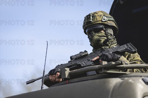 A Czech soldier occupies the hatch of a vehicle as part of the military exercise 'Wettiner Schwert' near Tangermünde, 26 March 2024. 'Wettiner Schwert' is part of the Quadriga exercise of the German Armed Forces and the NATO large-scale manoeuvre Steadtfast Defender 2024