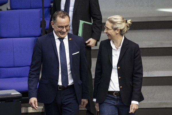 Tino Chrupalla, AfD, and Alice Weidel, AfD parliamentary group leader, arrive together in the plenary chamber of the German Bundestag in Berlin, 14 March 2024