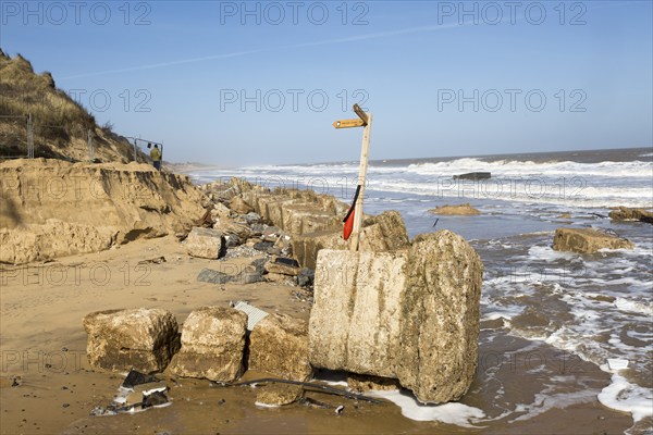 March 20 2018 Hemsby, UK. Coast path sign left abandoned by coastal erosion at Hemsby, Norfolk, England, UK