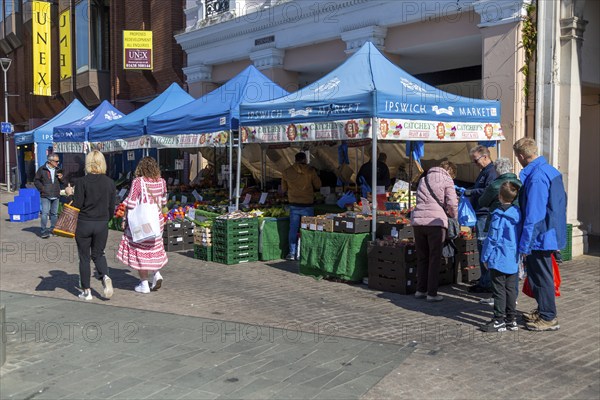 Market stalls on town centre street, The Cornhill, Ipswich, Suffolk, England, UK