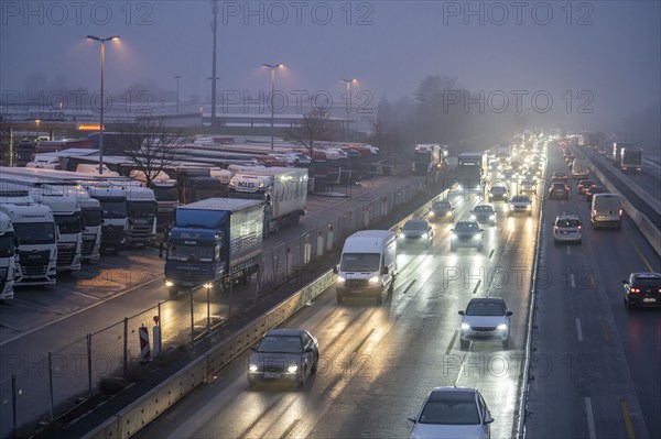 Heavy traffic on the A2 at the Bottrop-Süd service area, overcrowded lorry parking in the evening, Bottrop, North Rhine-Westphalia, Germany, Europe