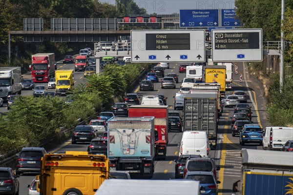 Traffic jam on the A3 motorway, over 8 lanes, in both directions, in front of the Leverkusen motorway junction, Friday afternoon high traffic volume, roadworks, gantry signs with journey times, delays due to the traffic jam, Leverkusen, North Rhine-Westphalia, Germany, Europe