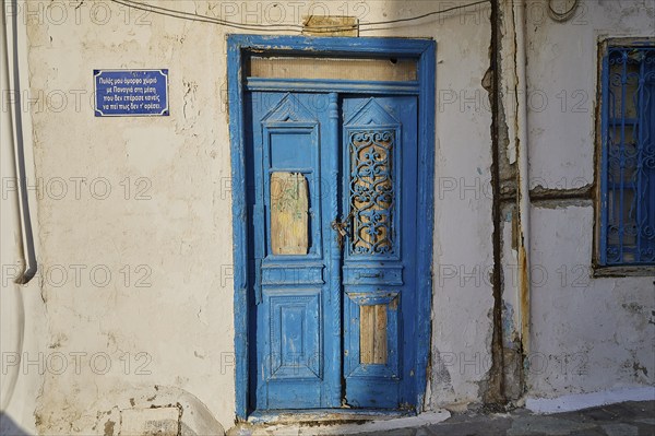 Detail of an old blue wooden door of a historic building, Pyles village, west coast, Karpathos, Dodecanese, Greek Islands, Greece, Europe