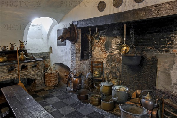 Kasteel van Laarne, interior showing kitchen and open fireplace inside 14th century medieval moated castle near Ghent, East Flanders, Belgium, Europe