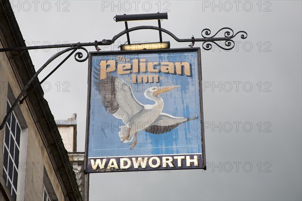 Pub sign for Wadworth beer at the Pelican Inn, Devizes, Wiltshire, England, United Kingdom, Europe