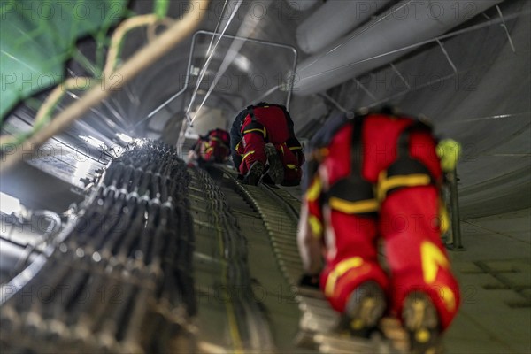 Height rescuers from the Oberhausen professional fire brigade practise abseiling from a wind turbine from a height of 150 metres, ascent into the turbine, to the nacelle, Issum, North Rhine-Westphalia, Germany, Europe