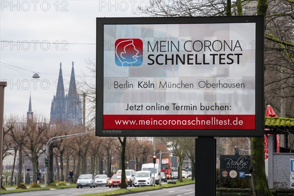 LED billboard, with digital advertising for Corona rapid tests, in the test centre in Cologne, on Konrad-Adenauer-Ufer in Cologne, North Rhine-Westphalia, Germany, Europe