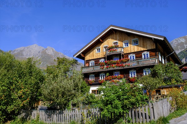 Farmhouse decorated with flowers. Burg district, Kals am Großglockner, East Tyrol, Austria, Europe