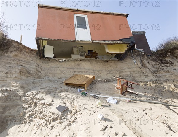 March 2018, Clifftop property collapsing due to coastal erosion after recent storm force winds, Hemsby, Norfolk, England, UK