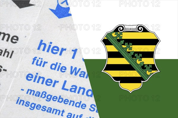 Symbolic image of state election in Saxony: Flag of Saxony and close-up of a ballot paper. The next state election will take place in September 2024