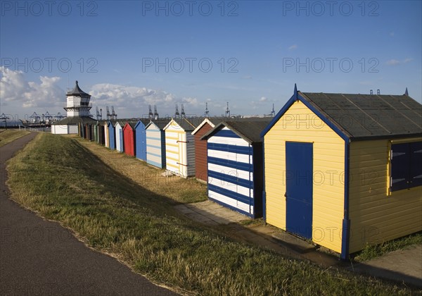 Colourful seaside beach huts and Low lighthouse maritime museum, Harwich, Essex, England, United Kingdom, Europe