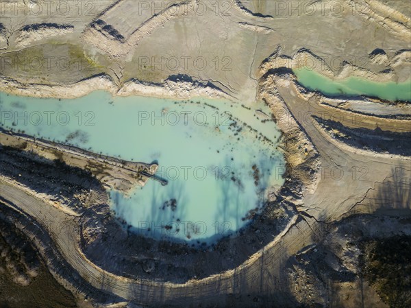 The Blue Hole, a residual hole from the kaolin mining operations of Kaolin- und Tonwerke Seilitz-Löthain GmbH, is now a natural paradise, but can only be entered by anglers, Ockrilla, Saxony, Germany, Europe