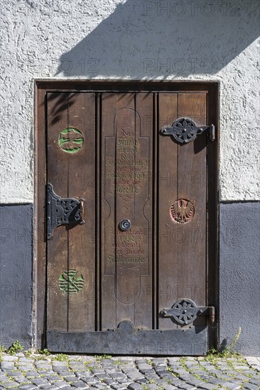 Old wooden door on a historic half-timbered building in the old town of Ulm, Baden-Württemberg, Germany, Europe