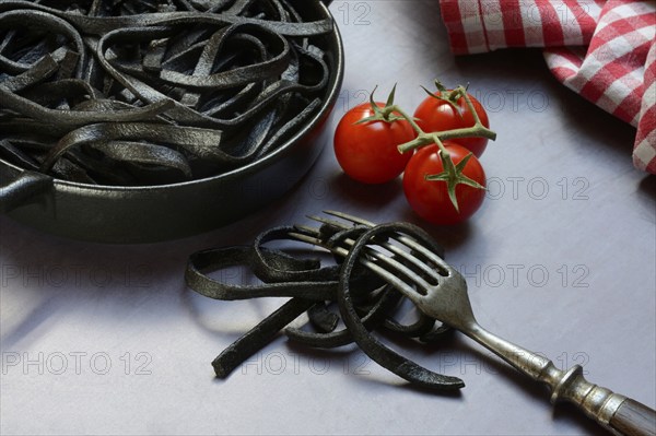 Black pasta coloured with squid ink in shell, Taglioni al Nero di Seppia, Italy, Europe