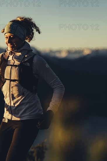 Trail running in autumn on the Jochberg on Lake Walchensee against the wonderful backdrop of the Alps, Bavaria, Germany, Europe