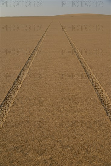 Car tracks in the sand in the Nubian Desert in Dongola, Northern, Nubia, Sudan, Africa