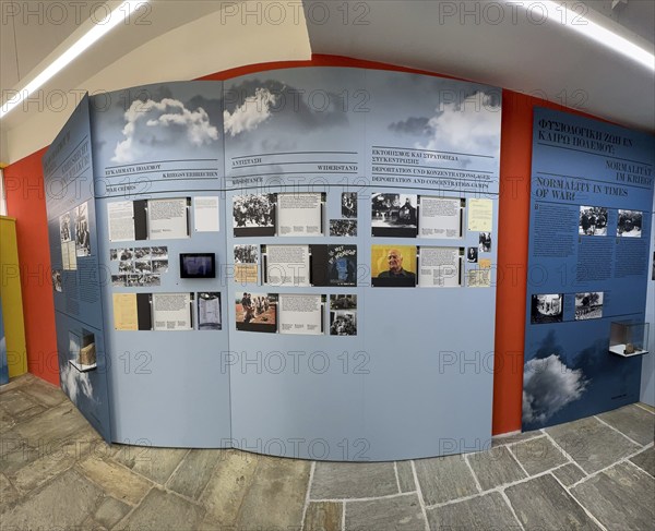 Part of exhibition in memorial site with display boards texts historical photos on history of German occupation of Crete in WW II at entrance to Maleme military cemetery, Maleme, Crete, Greece, Europe