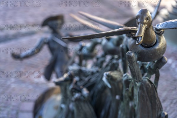 Münchhausen figure The ducks on a string at the Münchhausen fountain in Bodenwerder, Lower Saxony, Germany, Europe