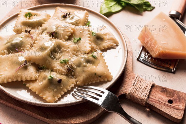 Ravioli with spinach and cheese, vegetarian food, on a beige background, no people.selective focus, rustic