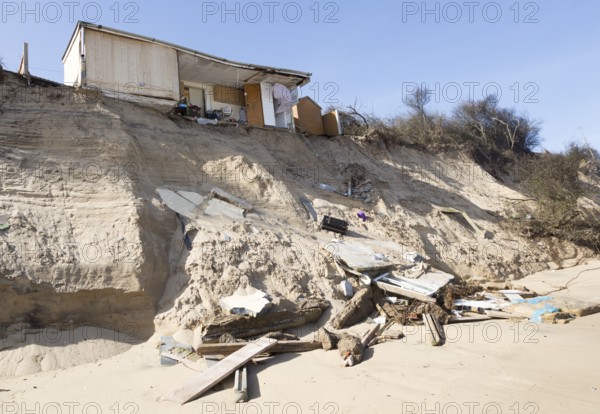 March 2018, Clifftop property collapsing due to coastal erosion after recent storm force winds, Hemsby, Norfolk, England, UK