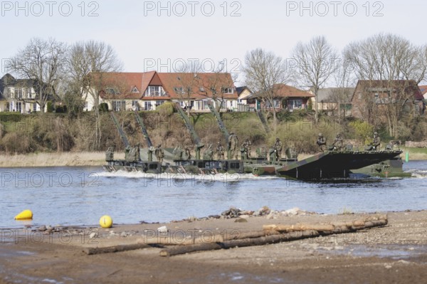 Amphibious vehicles of the type Amphibie M3 of the Bundeswehr taken during the military exercise 'Wettiner Schwert' near Tangermünde, 26.03.2024. 'Wettiner Schwert' is part of the Quadriga exercise of the Bundeswehr and the NATO large-scale manoeuvre Steadtfast Defender 2024