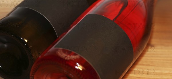 Close-up of two horizontal wine bottles