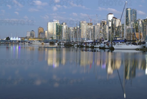 Skyscrapers and boats reflected in the sea at blue hour, downtown, Stanley Park, Vancouver, British Columbia, Canada, North America