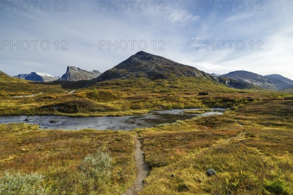 Autumn in Reinheimen National Park, mountains with river in Valldalen valley, Stigbotthornet mountain, Møre og Romsdal, Norway, Europe