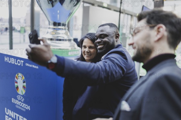 (R-L) Gerald Asamoah, former professional footballer, and Annalena Bärbock (Bündnis 90/Die Grünen), Federal Foreign Minister, photographed at the kick-off event for the European Football Championship in Berlin, 1 February 2024 / Photographed on behalf of the Federal Foreign Office