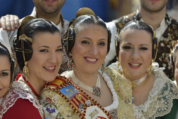 Fallas festival, women in a traditional costume during the parade in the Plaza de la Virgen de los Desamparados, Valencia, Spain, Europe