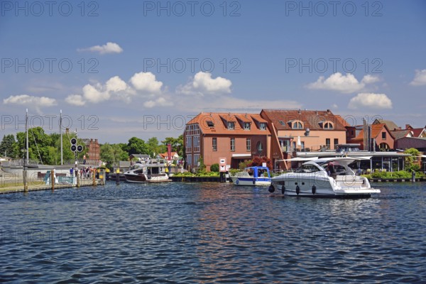 Europe, Germany, Mecklenburg-Western Pomerania, island town of Malchow, Lake Malchow, at the swing bridge, motor yacht, Malchow, Mecklenburg-Western Pomerania, Germany, Europe