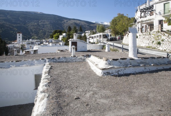 Traditional roofs and chimneys of houses in the village of Capileira, High Alpujarras, Sierra Nevada, Granada province, Spain, Europe