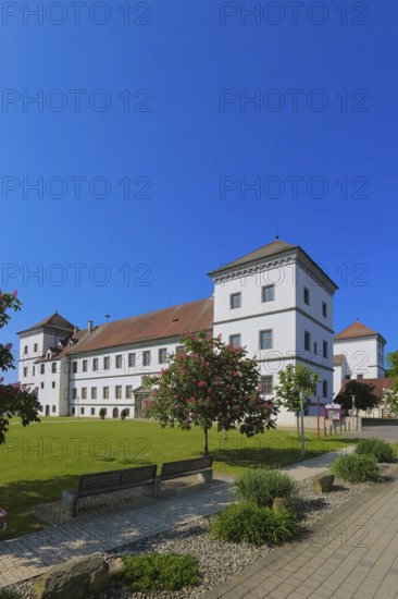 Meßkirch Castle, Castle of the Counts of Zimmern, Zimmern Castle, regular four-wing castle complex, Renaissance building, architecture, historical building, east view, park, castle garden, window, facade, benches, blue sky, Meßkirch, Sigmaringen district, Baden-Württemberg. Germany