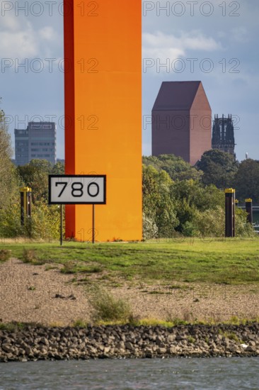 The sculpture Rhine Orange at the mouth of the Ruhr into the Rhine, skyline of the city centre of Duisburg, tower of the North Rhine-Westphalia State Archive, town hall tower and Salvator Church, North Rhine-Westphalia, Germany, Europe