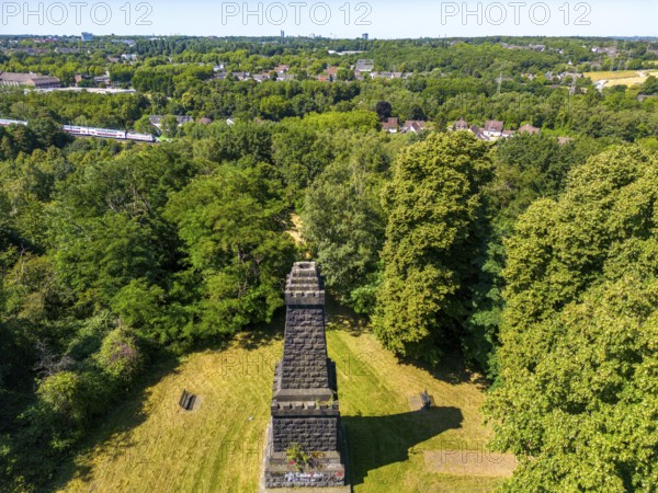 The Mechtenberg in Essen, one of the few natural elevations from the ice age in the Ruhr area, was once 100 metres above sea level, but due to mining subsidence it is now only around 80 metres above sea level, Bismarck Column, view to the west towards Essen, part of the Mechtenberg Landscape Park, North Rhine-Westphalia, Germany, Europe