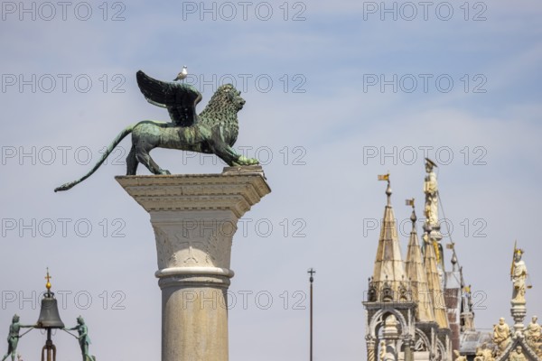 View of the city from the Canale della Giudecca, granite column on St Mark's Square with the Lion of Venice, Venice, Italy, Europe