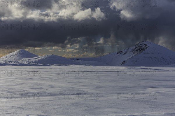 Cloudy mood and snowstorm over an old volcano, snow, winter, Neshraun, Snaefellsnes, Vesturland, Iceland, Europe