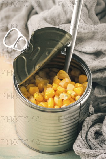 Open tin can, with corn, top view, selective focus, no people, close-up