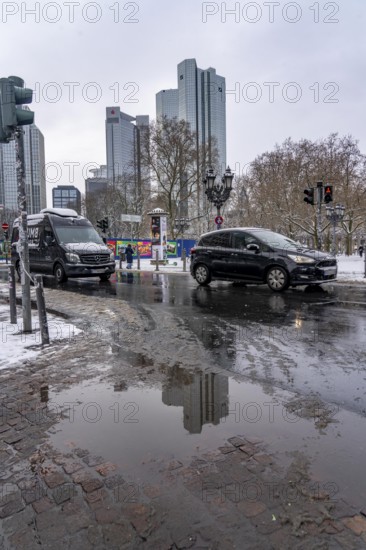 Puddle, winter in the city, Deutsche Bank building, Sparkasse, Trianon Frankfurt building, Gallusanlage street, Frankfurt am Main, Hesse, Germany, Europe