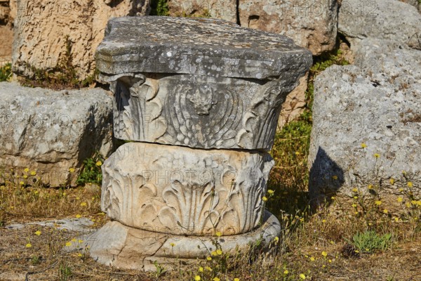 An ancient column base with floral stone reliefs in the open air, Archaeological Museum, Archea Korinthos, Corinth, Peloponnese, Greece, Europe