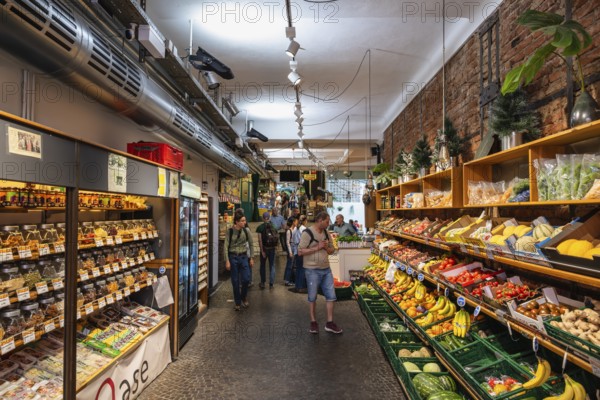 Fruit and vegetable stalls in the Freiburg market hall in the historic city centre of Freiburg im Breisgau, Baden-Württemberg, Germany, Europe