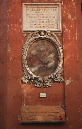 Image of a saint on a house wall at Campo de Fiori, Rome. Italy