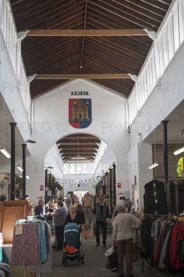 Shoppers inside the historic Shambles market hall in Devizes, Wiltshire, England, United Kingdom, Europe