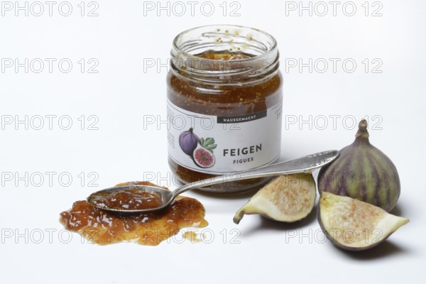 Fig jam in a jar and spoon with fig jam, fresh figs, Ficus carica