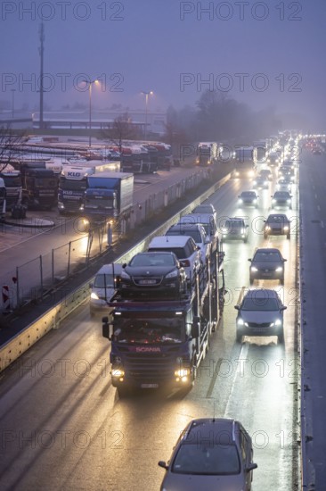 Heavy traffic on the A2 at the Bottrop-Süd service area, overcrowded lorry parking in the evening, Bottrop, North Rhine-Westphalia, Germany, Europe