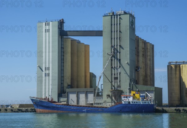 Loading of grain from silo to ship in Ystad harbour, Skåne County, Baltic Sea, Sweden, Scandinavia, Europe